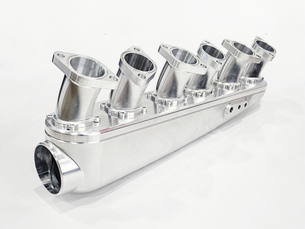 5 axis cnc milled aluminum manifold 5-axis CNC milled aluminum intake manifold with complex geometry and polished finish