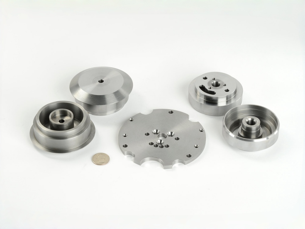Precision CNC Turned Components Precision CNC turned stainless steel and aluminum parts including shafts and flanges